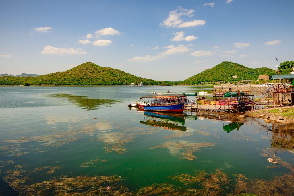 Fateh Sagar Lake Udaipur surrounded by Aravalli Hills with boats on the water