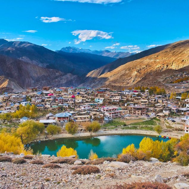 xr:d:DAF2p_9NLno:7,j:2958150993885477159,t:23121107 Elevated view of Nako village, lake and the dry mountains of the Hangrang Valley