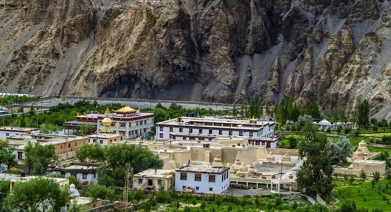aerial or elevated view of Tabo village and monastery complex, Spiti Valley Aerial view of Tabo village and monastery surrounded by Spiti Valley's cold desert landscape