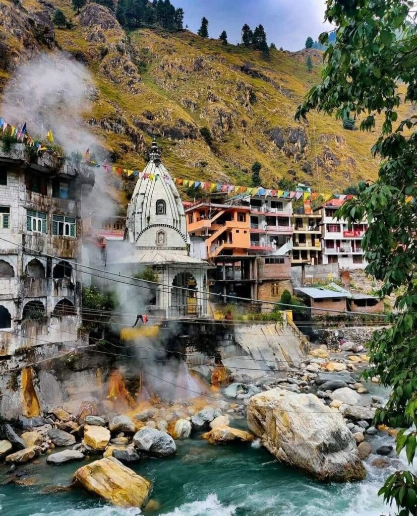 gurudwara building beside a river with visible steam rising from natural hot spring Manikaran Sahib Gurudwara and hot springs near Kasol