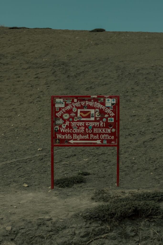 Signboard at the world's highest post office in Hikkim, Himachal Pradesh, India.
