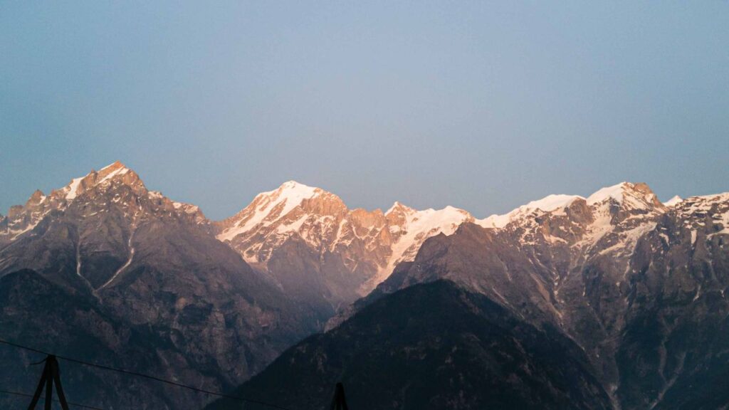 Experience the majestic snowcapped Himalayas at sunset in Kalpa, Himachal Pradesh. Sunrise view from Kalpa viewpoint over the Kinnaur valley