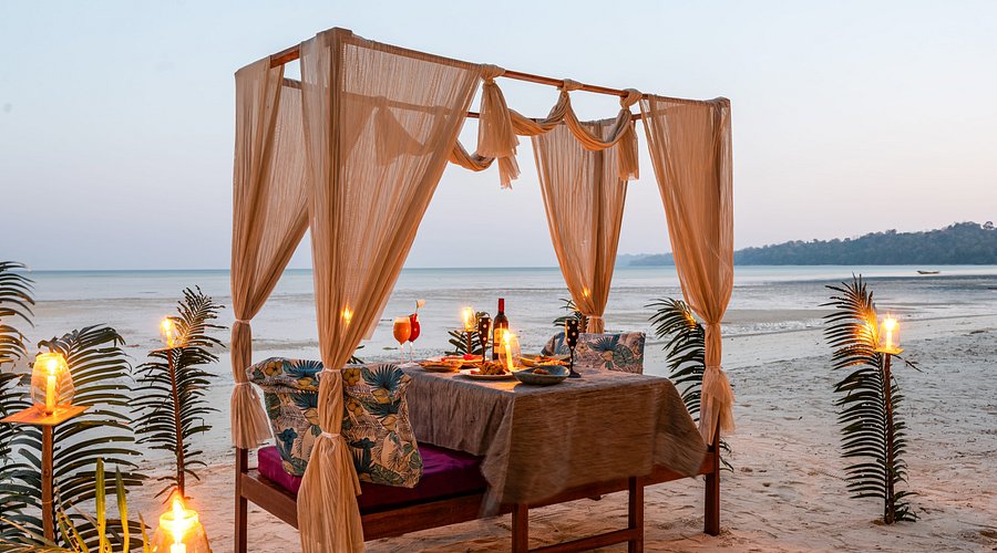 Beachside table at one of the best restaurants in Neil Island at sunset