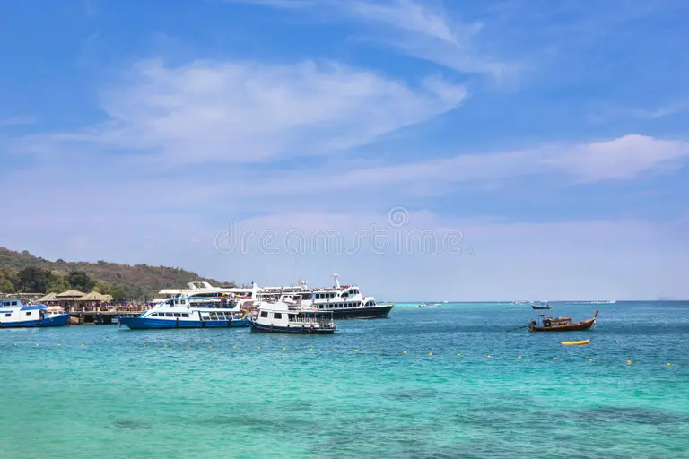 cruising-ships-boats-moored-andaman-sea-phi-phi-don-island-thailand-blue-sky Chatham to Bambooflat ferry, the shortcut for a Mount Harriet day trip from Port Blair