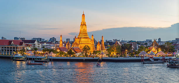 Bangkok sightseeing view of Wat Arun and the Chao Phraya River at sunset